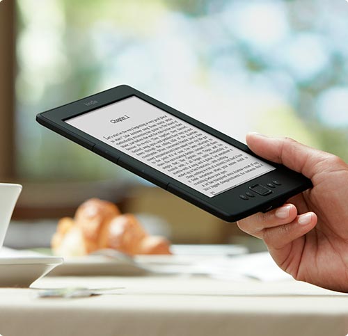 An eInk Kindle--the Voyage, I believe, showing the lightweight, convenient size.